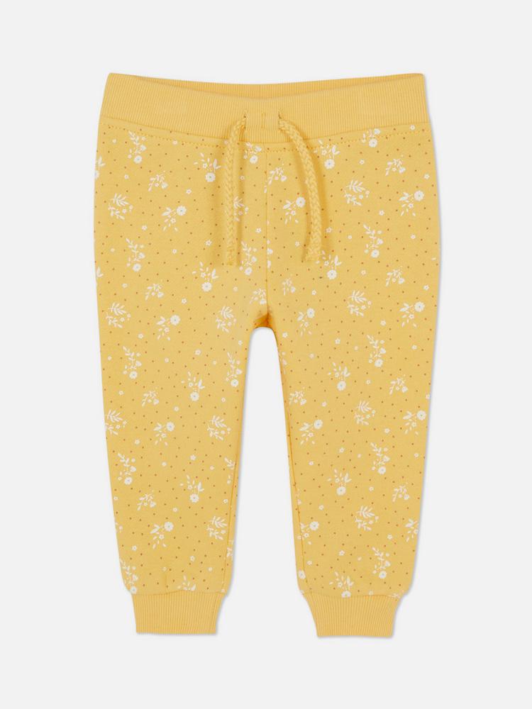 Calça moletom amarela floral