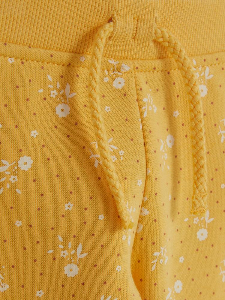 Calça moletom amarela floral
