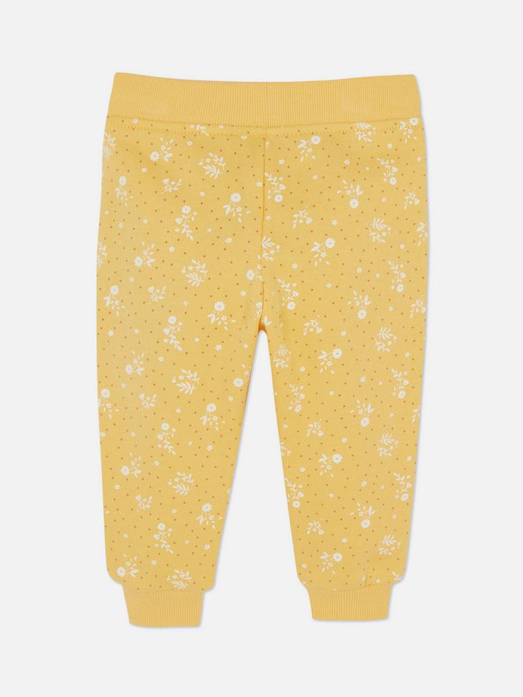 Calça moletom amarela floral